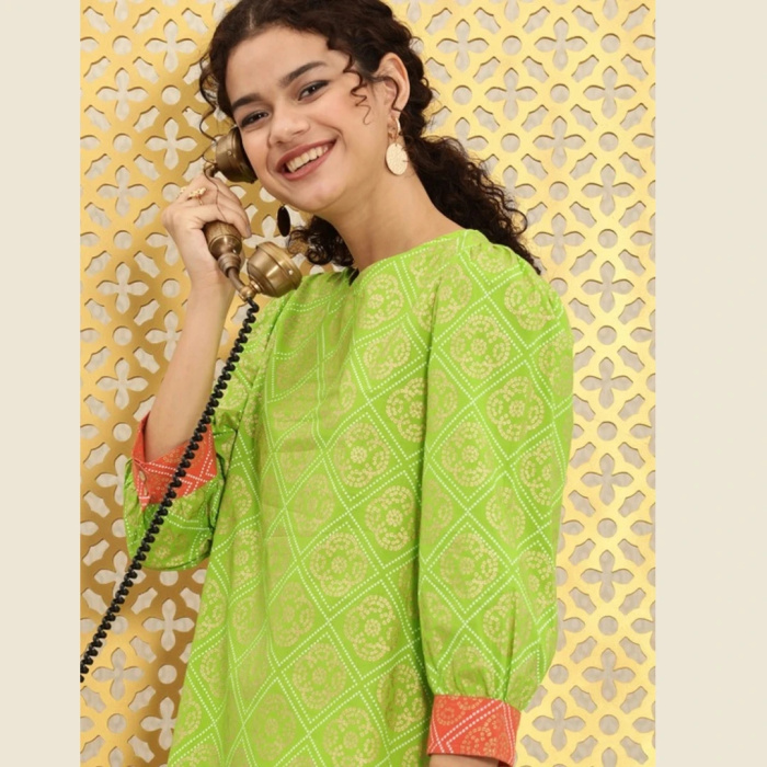 Side View of Women’s Green Bandhani Foil Print Kurta with White Pants